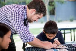 Teacher helping student